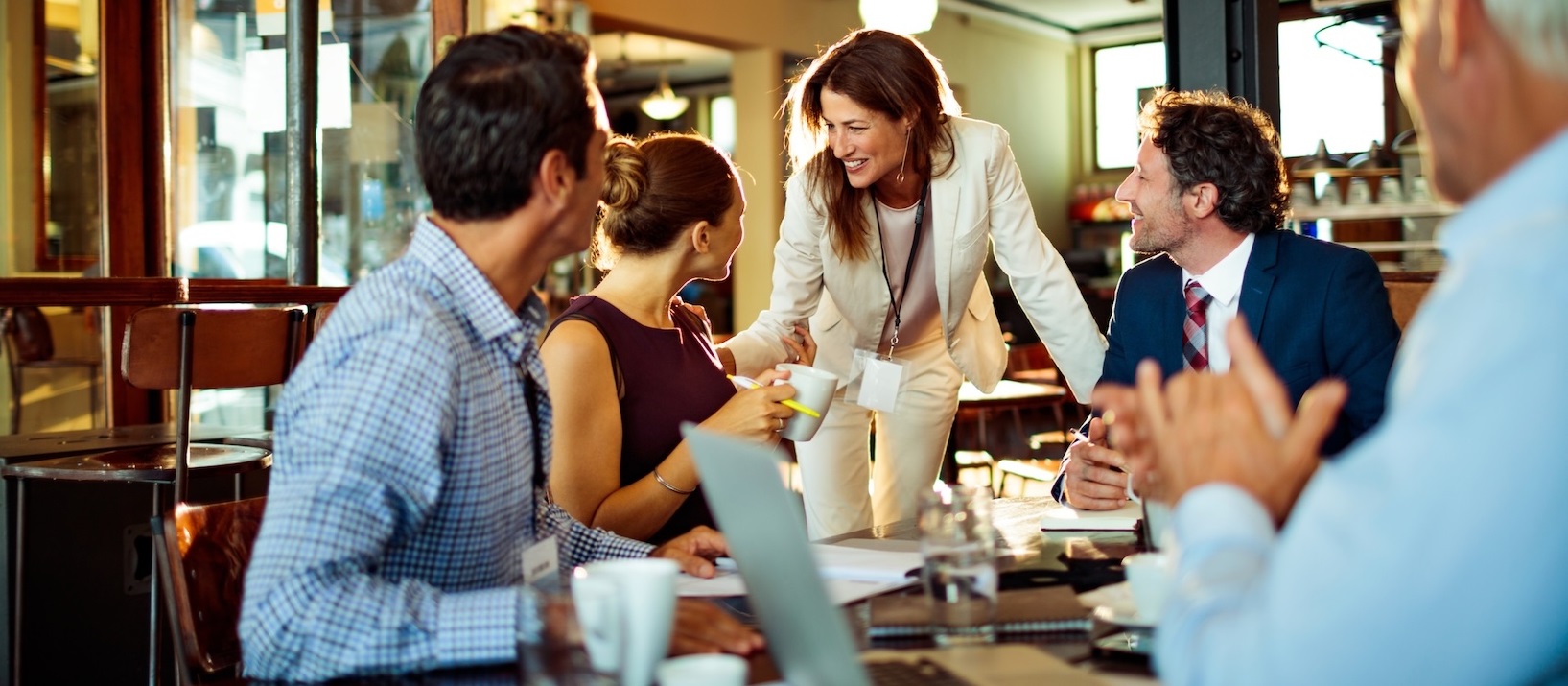 People discussing something around a table.